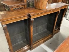 19th cent. Rosewood break front bookcase with applied carved mouldings, on a plinthed base. 72ins. x