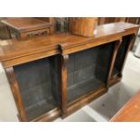 19th cent. Rosewood break front bookcase with applied carved mouldings, on a plinthed base. 72ins. x