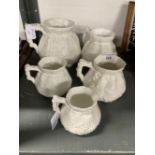 Late 19th/Early 20th cent. Ceramics: Five white porcelain graduated cider jugs, unsigned but with
