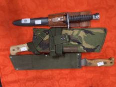 Militaria/Edged Weapons: Swiss FUM 57 bayonet and scabbard and two British post-1970s machetes. (3)