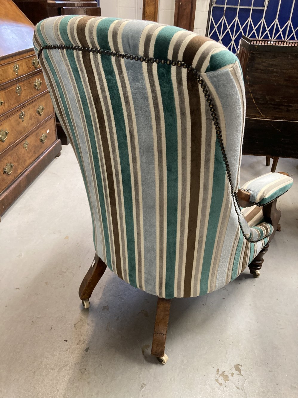 19th cent. Button back library armchair with scroll arms and turned legs on castors. 40ins. High. - Image 3 of 3