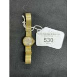 Watches: Lady's hallmarked 9ct gold Omega bracelet watch, round silver colour dial. Total weight