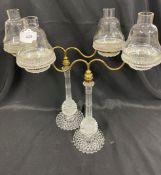 1890-1900 Clarke's cricklite candle holder twin lamp glasses on brass fittings, a pair.