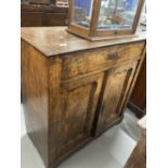 19th cent. Continental rosewood cupboard with single drawer above two doors with a recessed