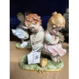 20th cent. Ceramics: Crown Naples boy and girl embracing, basket of flowers between them. N and