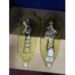 20th cent. ceramics: Crown Naples wall plaques lovers on ladders. A pair. 9ins.