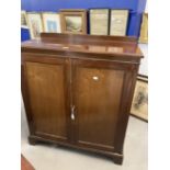 Early 20th cent. Mahogany two door cupboard on bracket supports with later internal additions.