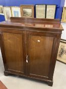 Early 20th cent. Mahogany two door cupboard on bracket supports with later internal additions.