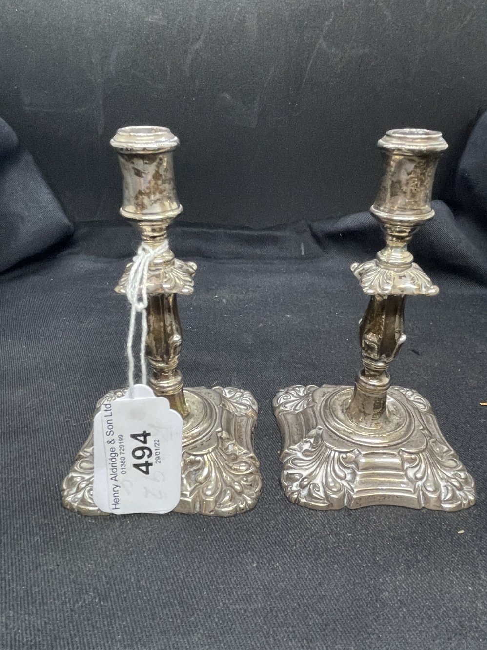 Hallmarked Silver: Pair of miniature candlesticks. Hallmarked Birmingham 1921. Weight 6.9oz.