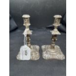 Hallmarked Silver: Pair of miniature candlesticks. Hallmarked Birmingham 1921. Weight 6.9oz.