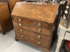 Early Georgian mahogany bureau with finely fitted interior over four graduated drawers, with