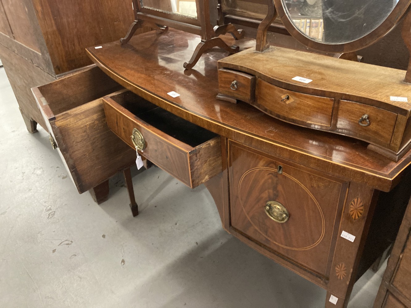 Georgian bow fronted mahogany cabinet with a single central drawer flanked by two deep cellarette - Image 2 of 4