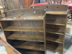 Arts & Crafts: A pair of oak five shelf bookcases with hearts carved into the top. 36ins. x 49ins. x