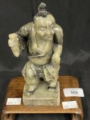 Chinese: Early 20th cent. Carved soapstone figure of a man drinking from a cup, attached to a lamp