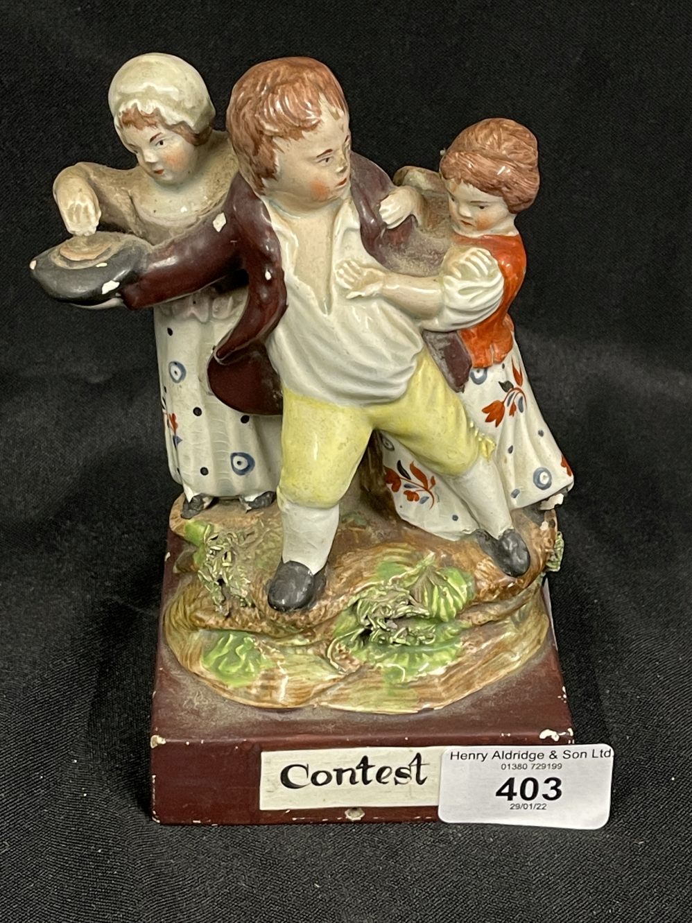 Early 19th cent. English pearlware group 'The Contest' on brown base, possibly Dudson. 6¾ins. x 3¾