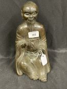 18th/19th cent. Qing Dynasty bronze figure of a Doaist Immortal shown seated in a long flowing robe,