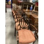 19th cent. Harlequin set of eight mahogany shield back chairs with two carvers.