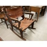 Mid century design 1960s leather tooled rocking chair in the style of Angel Pazmino. 33ins. x