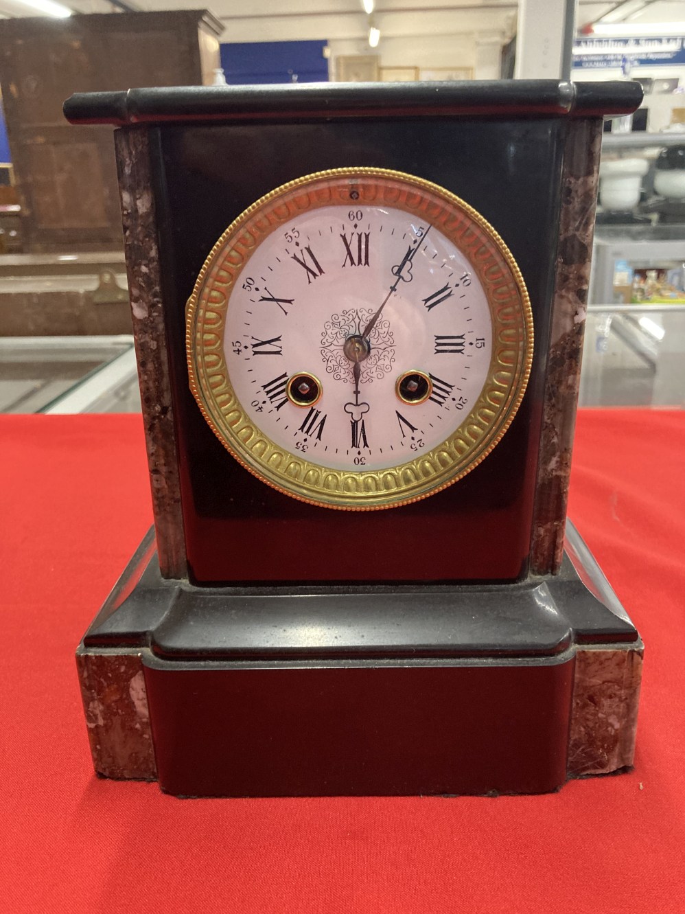 Clocks: 19th cent. French black and brown/red marble mantel clock, enamelled face with Roman