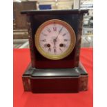 Clocks: 19th cent. French black and brown/red marble mantel clock, enamelled face with Roman