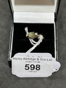 Jewellery: Yellow metal ring set with a cabouchon cut cat's eye, estimated weight 0.65ct, with a