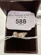 Hallmarked Gold: 14ct gold ring set with a round and baguette cut white cubic zirconia hallmarked