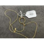 Jewellery: Yellow metal chain tests as 18ct gold, length 20ins. with a coin mount attached tests