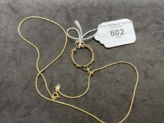 Jewellery: Yellow metal chain tests as 18ct gold, length 20ins. with a coin mount attached tests