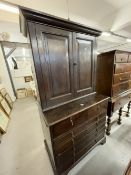 18th cent. Oak interesting cupboard with two panelled doors and two shelves over a chest of two