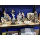 Continental Porcelain: Various figures to include a mother and children, young couples, a golfer,