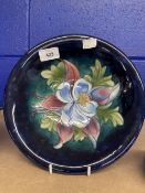 William Moorcroft 'Orchid' deep dish c1930-40 decorated with a blossoming orchid on a blue ground,