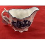 18th cent. English blue/white sauce boat spiral fluted with moulded acanthus leaves and elaborate