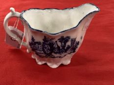 18th cent. English blue/white sauce boat spiral fluted with moulded acanthus leaves and elaborate