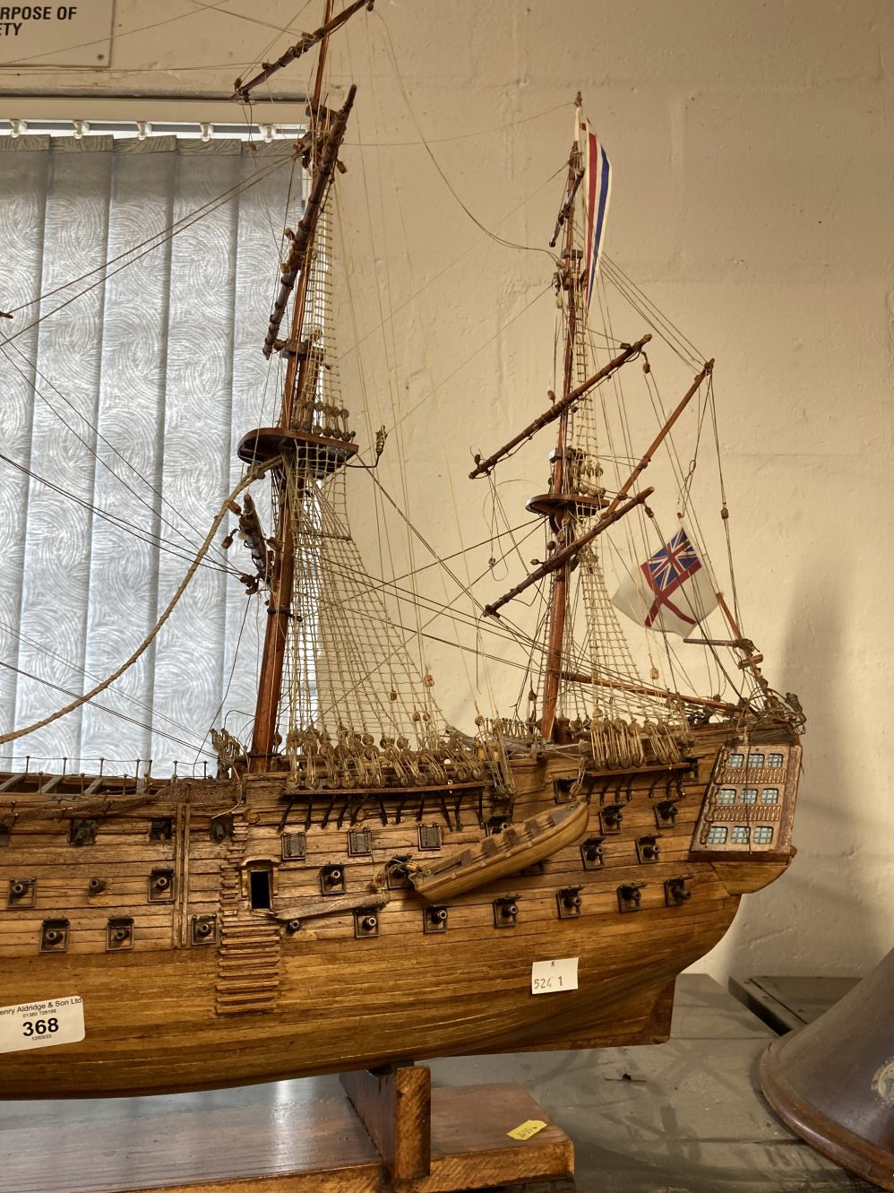 H.M.S. Victory: Treen model on stand 34ins. In need of restoration. Plus a framed portrait of Her - Image 4 of 5