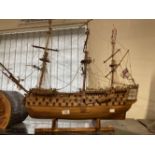 H.M.S. Victory: Treen model on stand 34ins. In need of restoration. Plus a framed portrait of Her