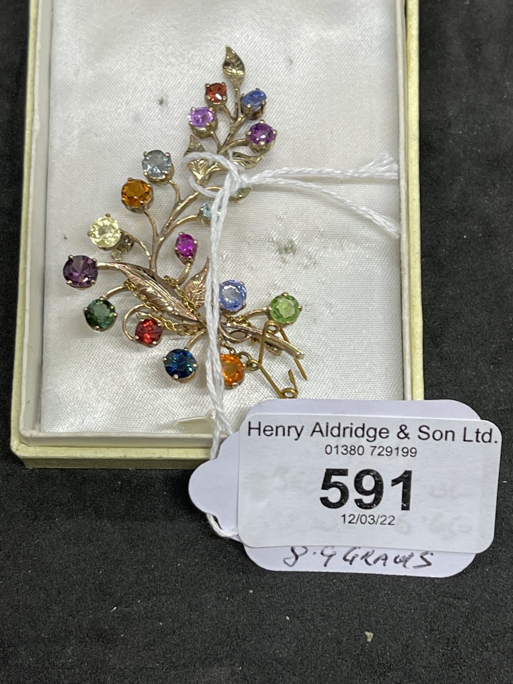 Jewellery: Yellow metal leaf spray brooch set with rubies, sapphires, tourmaline, citrine, garnets