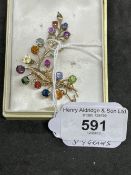 Jewellery: Yellow metal leaf spray brooch set with rubies, sapphires, tourmaline, citrine, garnets