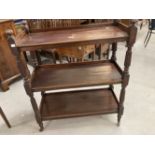 19th cent. Mahogany three tier buffet with reeded columns mushroom top finials, turned legs on