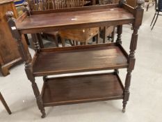 19th cent. Mahogany three tier buffet with reeded columns mushroom top finials, turned legs on