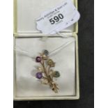 Jewellery: Yellow metal leaf spray brooch set with sapphire, amethyst, zircon, spinel and garnet,