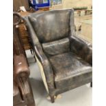 Andrew Martin Harrow style leather and fabric high back armchair.