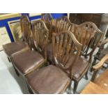 Late 19th cent. Mahogany shield back dining chairs with drop in seats on square tapering legs on