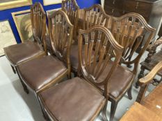 Late 19th cent. Mahogany shield back dining chairs with drop in seats on square tapering legs on
