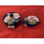 Moorcroft 'Magnolia' pattern boxes each decorated with blossoming magnolias on a blue ground,