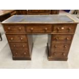 Late 19th cent. Mahogany twin pedestal desk, nine drawers all with knob handles on a square plinth