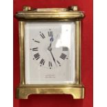 Clocks: 20th cent. Brass small carriage clock J. Vincent, Weymouth. 4¼ins.