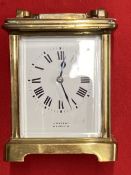 Clocks: 20th cent. Brass small carriage clock J. Vincent, Weymouth. 4¼ins.