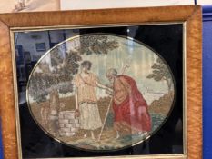 19th cent. Silk woolwork picture of a Saint placing a bangle on the arm of a woman, in burr maple