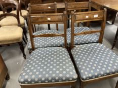 19th cent. Mahogany dining chairs with bar backs over upholstered seats on turned and reeded