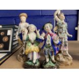 Schierholz Figurines: Young girl and boy decorated in coloured enamels, he's holding a tambourine